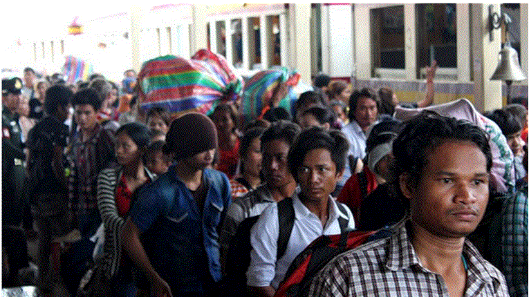 Photo credit: Undocumented Cambodian migrants arrive by train at Anranya Prathet, Thailand prior to onward transportation to the border. © International Organization of Migration 2014, Joe Lowry